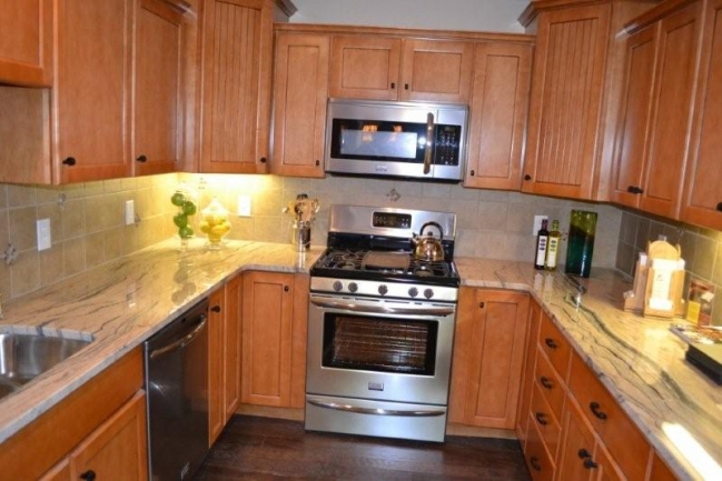 Easy flow kitchen with stainless appliances.
